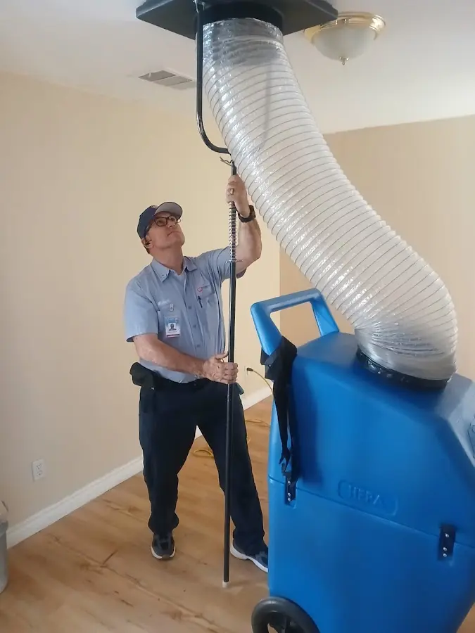 Furnace Tune-Up technician using HEPA equipment in Fair Lawn